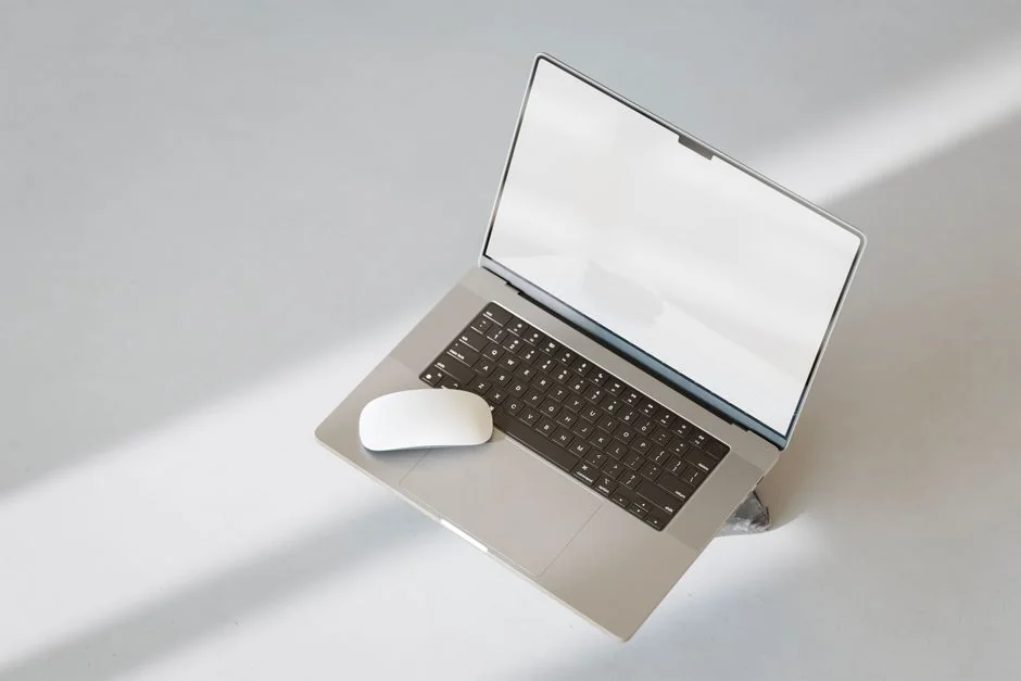 A contemporary workspace showcasing a laptop, tablet, and smartphones, ideal for tech and freelance use.